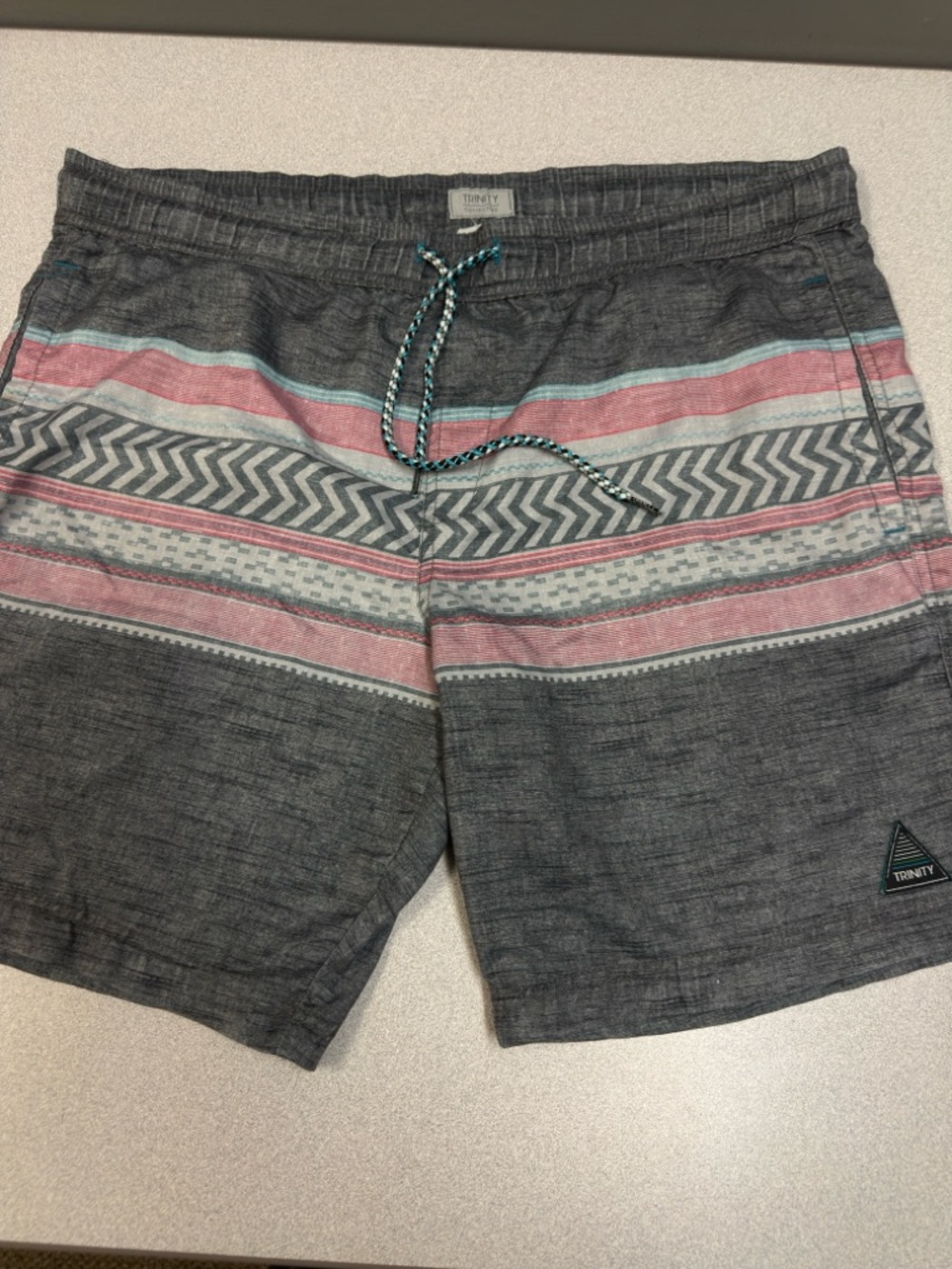 Trinity Men’s Gray Swim Trunks with Pink and Light Blue‎ Stripes